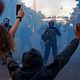 Police officers wearing riot gear push back demonstrators outside the White House June 1, 2020, during a protest over the death of George Floyd, an unarmed black man who died after a police officer kneeled on his neck for several minutes.